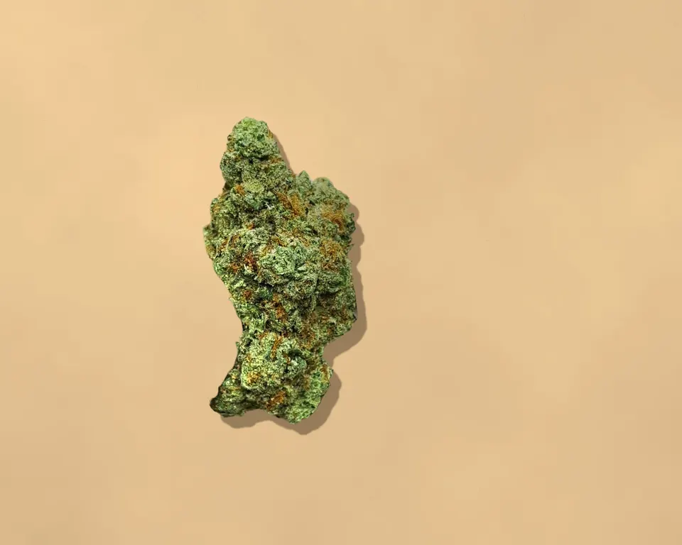 Pineapple Express THCA flower on kraft paper, indoor